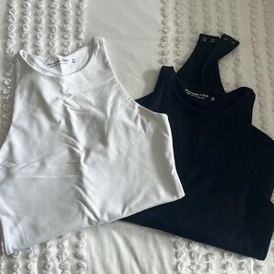 White and black Abercrombie body suits